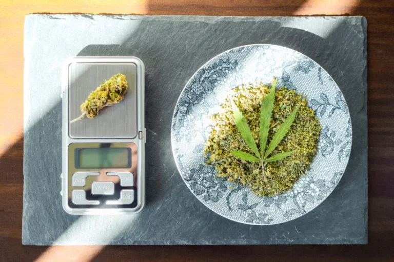 A pound of weed on top of a weighing scale.