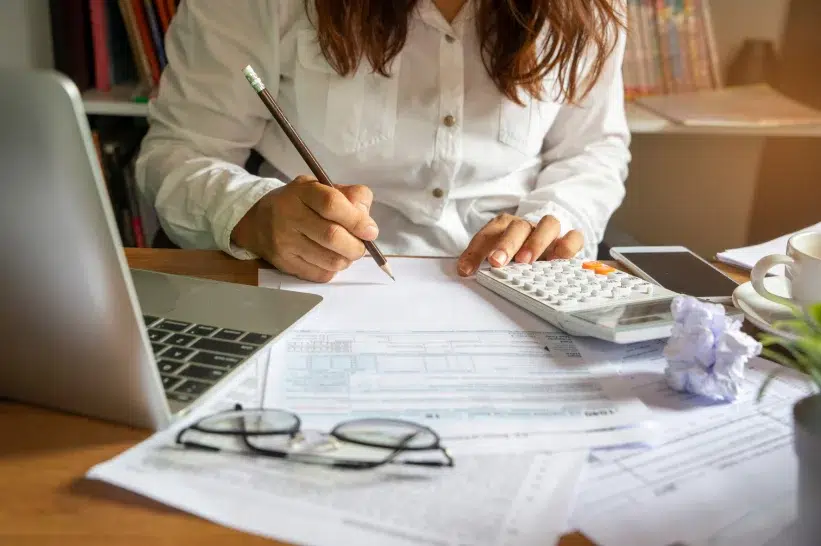 A woman writing a business plan.